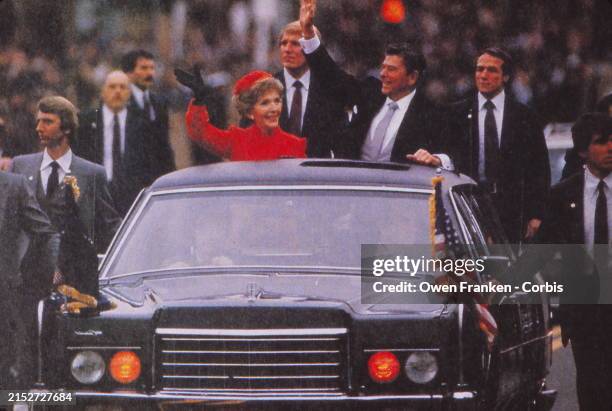 Nancy and Ronald Reagan waving from their limousine during his first Inauguration January 20, 1980 Washington, DC.
