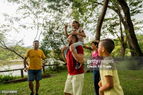 family a having fun on the public park - step father stock pictures, royalty-free photos & images