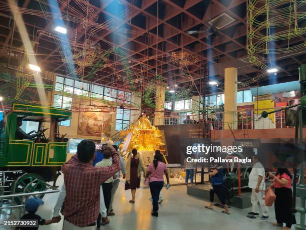 March 8: Public watching the life size model of the Vikram Lander and Pragyan rover part of the highly successful mission to the moon named...