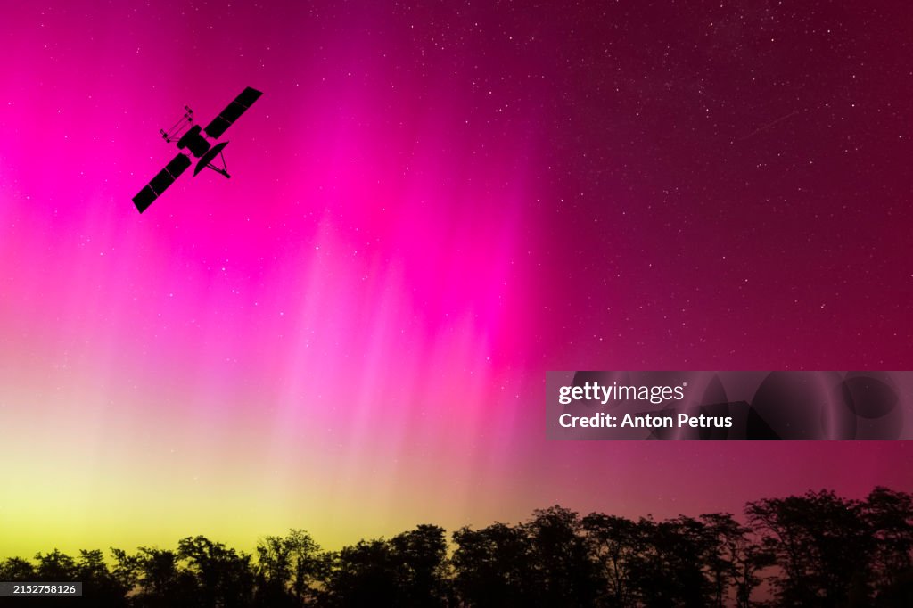 Satellite on the background of the northern lights