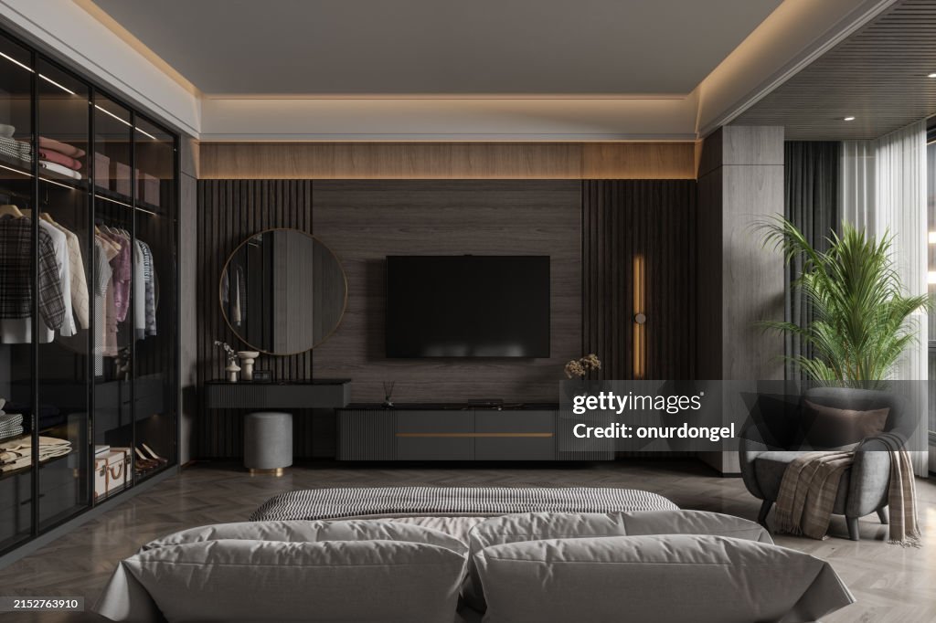 Interior De Dormitorio Moderno Con Televisor, Tocador, Vestidor, Sillón Y Vista Trasera De Cama Doble Por La Noche