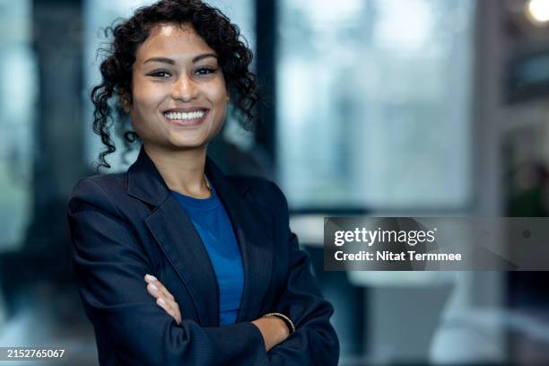 support women-led businesses and initiatives can boost company growth. portrait of a confident business executive founder with arms crossed working in a modern business office. - initiative photos et images de collection