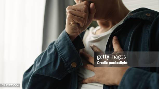 man was suffering from painful chest pain from a chronic disease. - hoesten stockfoto's en -beelden