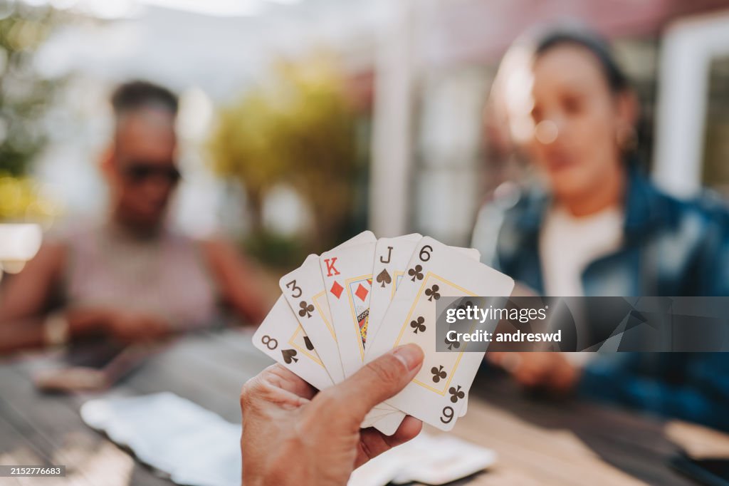 Hand holding playing cards
