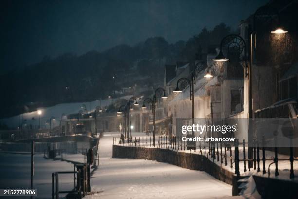 snow in lyme regis, seafront - lime stock pictures, royalty-free photos & images