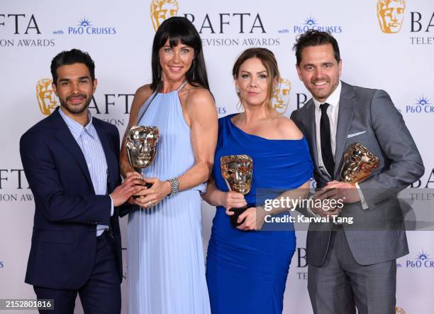 Neet Mohan, Kirsty Mitchell, Elinor Lawless and Michael Stevenson pose with the Soap Award for 'Casualty' in the Winners Room during the 2024 BAFTA...