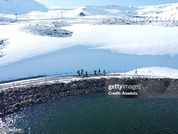 An aerial view of slope as people slalom down steep slopes with their ski sets, in Erzurum, Turkiye on May 15, 2024. A group of coaches, trainers and...