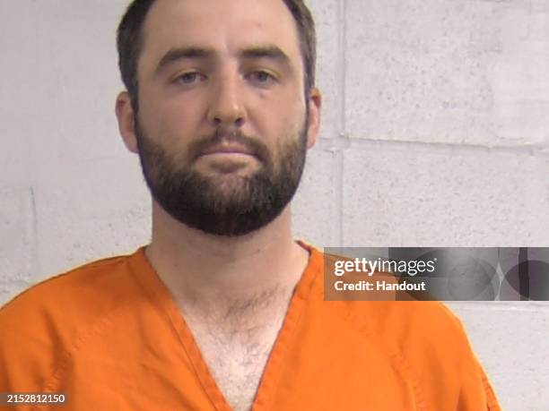 In this handout photo provided by the Louisville Department of Corrections, Scottie Scheffler is seen in a police booking photo after being arrested...