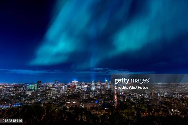 photo of montreal skyline with northern lights. - quebec stock pictures, royalty-free photos & images