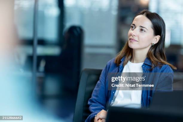 focus on business process improvement to increase your competitiveness and business excellence. a business development manager listens to a presentation from her team during a business process improvement strategy meeting in a modern office. - cashflow stock pictures, royalty-free photos & images