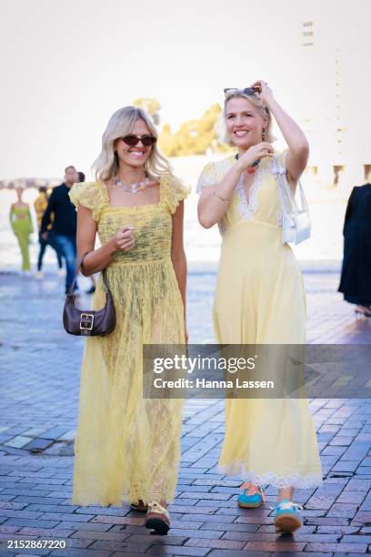 Guest wearing yellow lace dress during Australian Fashion Week Presented By Pandora 2024 at Carriageworks on May 14, 2024 in Sydney, Australia.
