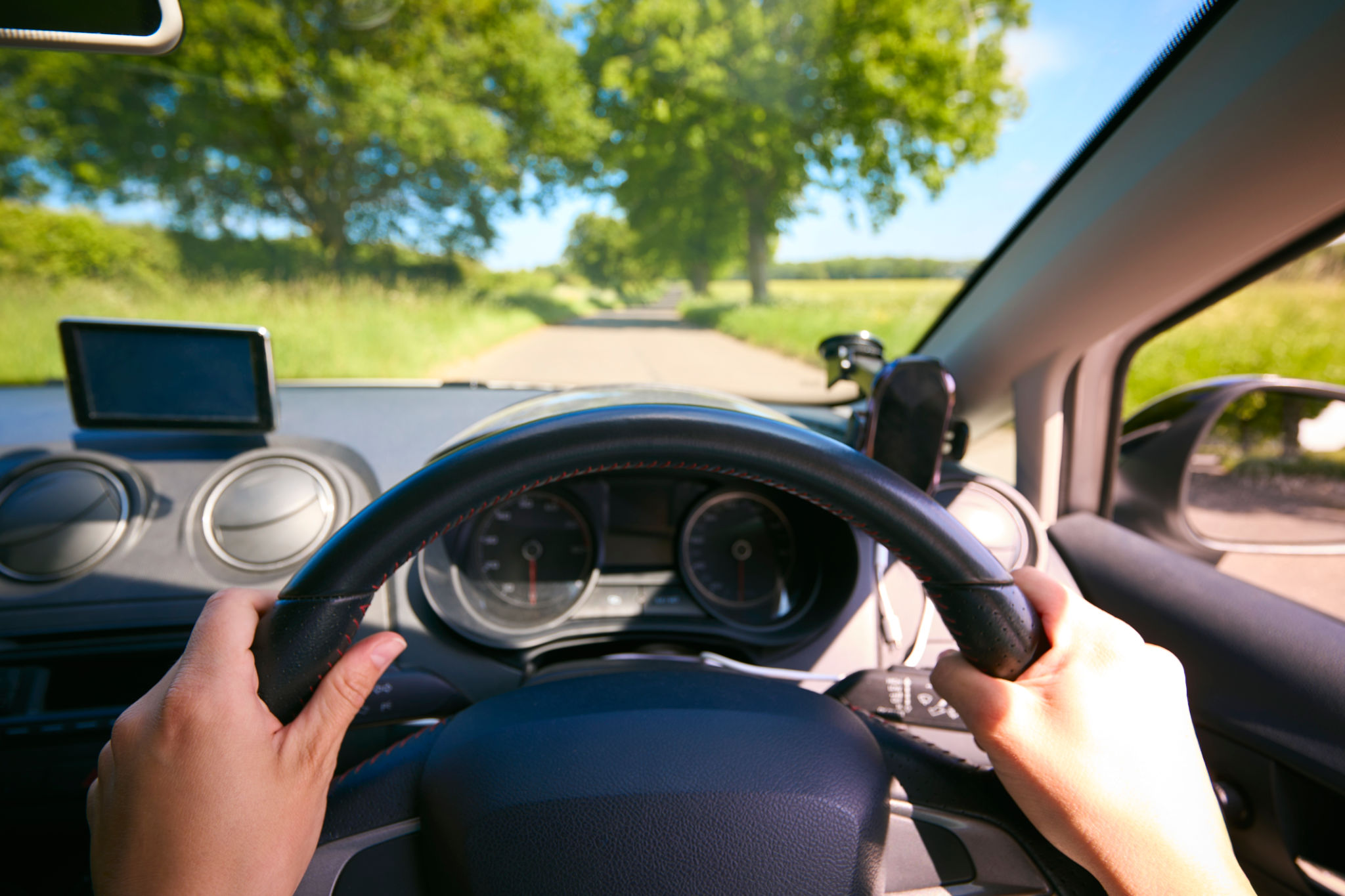 POV Shot Of Woman's Hand On Steering Wheel Driving, state anxiety POV Shot Of Woman's Hand On Steering Wheel Driving, state anxiety