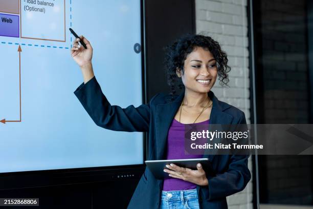 agile project management enables continuous optimization. shot of a project manager giving a presentation on a business process flow over a device screen to her team in a modern office meeting room. - project management process flow chart stock pictures, royalty-free photos & images