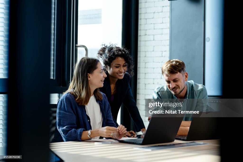 Use Performance Insights To Drive Business Growth. Team of business development is on a data discussion to improve solutions, products, or services during a meeting in a business office.