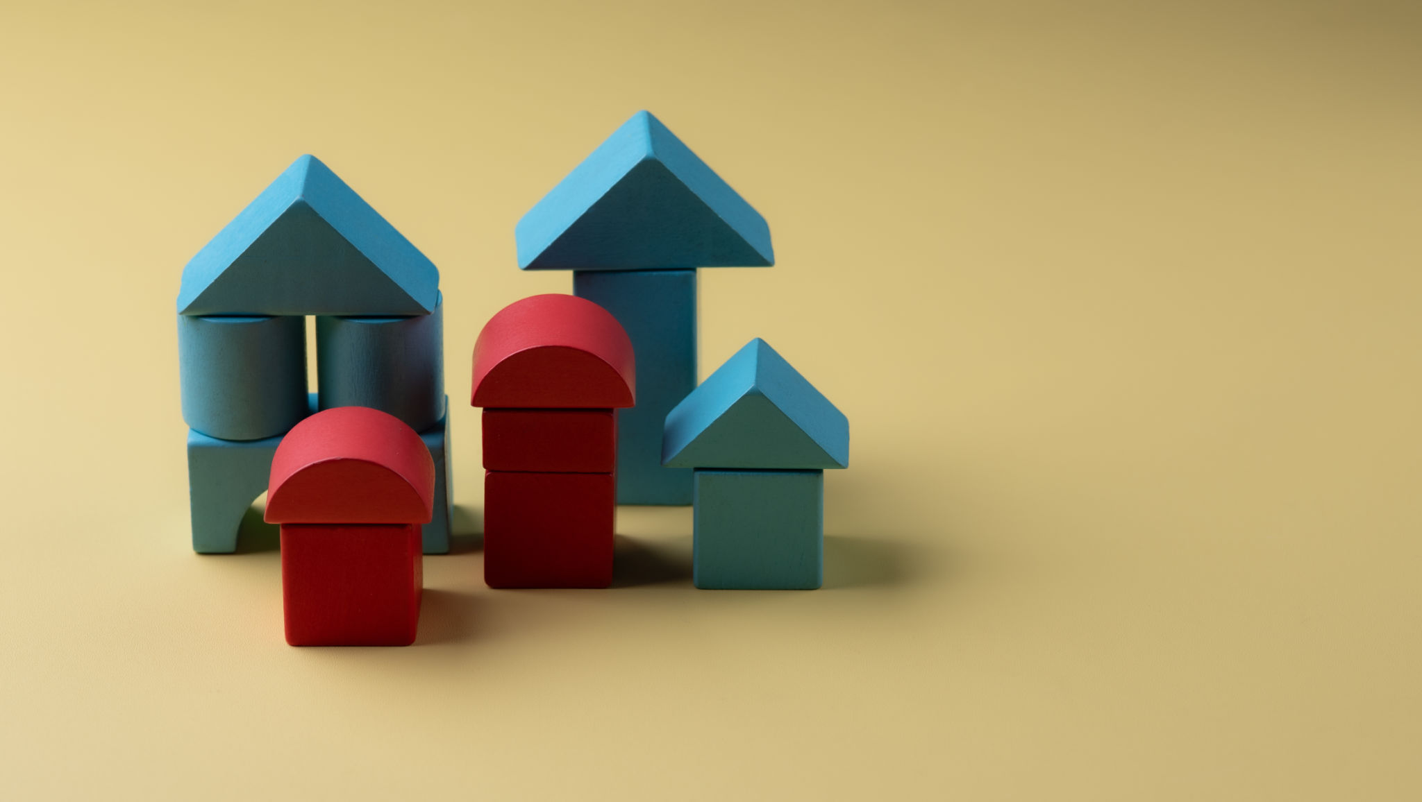 Wood House Model on yellow background and free copy space for your text. Wood House Model on yellow background and free copy space for your text.