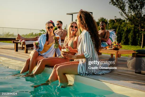 group of friends having fun by the pool - poolside gathering stock pictures, royalty-free photos & images