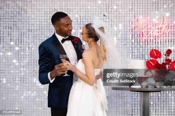 sharing a drink as husband and wife - bruidegom stockfoto's en -beelden
