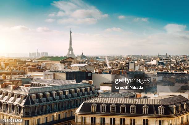 cityscape view of paris skyline with eiffel tower and rooftops. paris, france - ile de france stock pictures, royalty-free photos & images