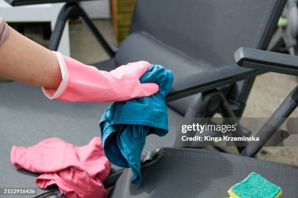 cleaning outdoor furniture - outdoor chair stock pictures, royalty-free photos & images