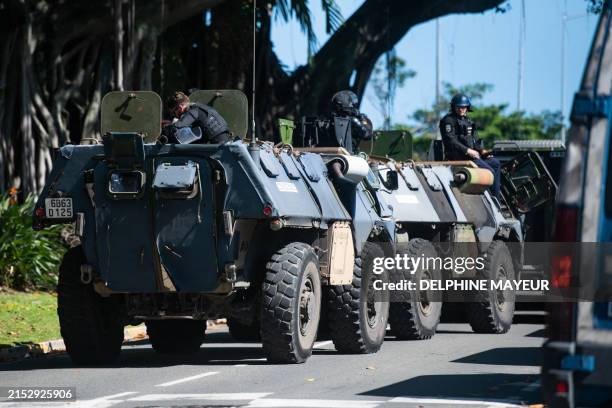 Gendarmerie armoured vehicles are seen near a police station in Noumea, France's Pacific territory of New Caledonia, on May 18, 2024. Hundreds of...