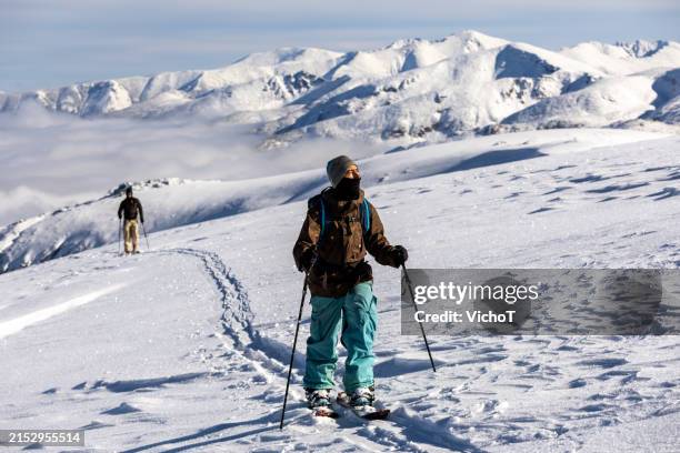 back country snowboarder walking on a beautiful high mountain ridge - comfort zone stock pictures, royalty-free photos & images