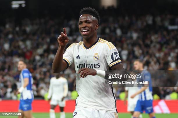 Vinicius Junior of Real Madrid celebrates scoring his team's second goal during the LaLiga EA Sports match between Real Madrid CF and Deportivo...