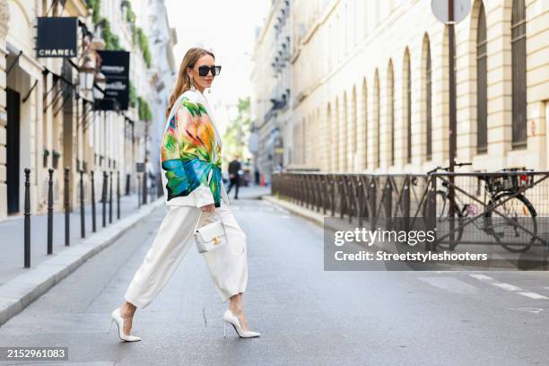 Alexandra Lapp is seen wearing a Leo Lin Jocelyn Embroidered split blazer with papillon print, a Rossi x C.Wirschke culotte in creme, Saint Laurent...