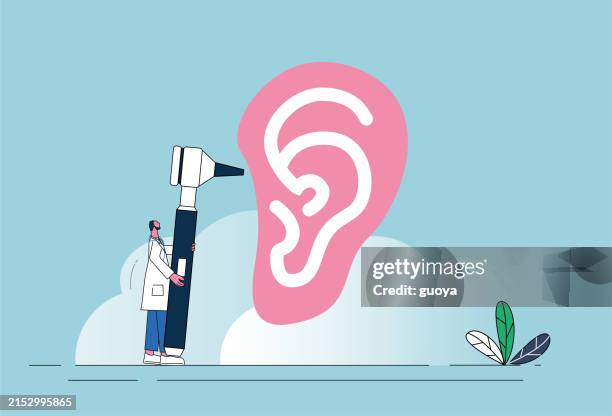 the doctor examines the ear with an otoscope. - pinna stock illustrations