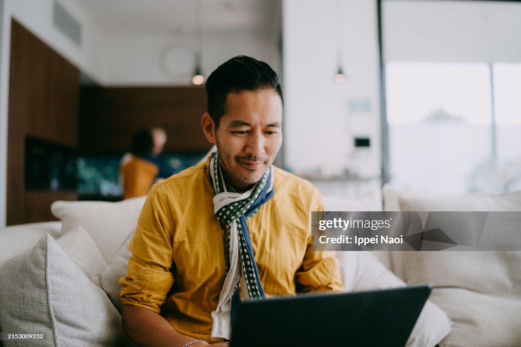 Man working with laptop at home