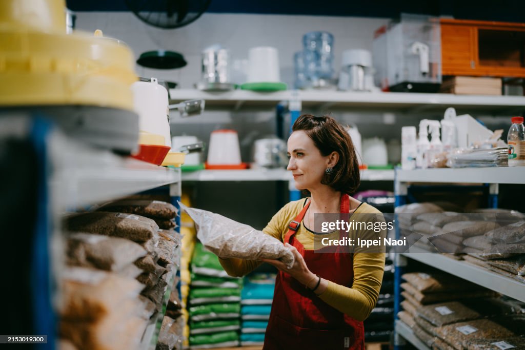 Restocking Sign Store Woman Working In Store Restocking Retail Display High-Res Stock Photo ...