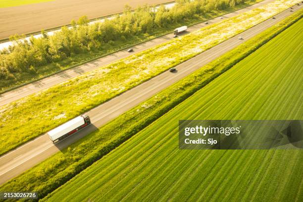 traffic on the a6 highway in flevoland netherlands during springtime sunset - pickup bildbanksfoton och bilder