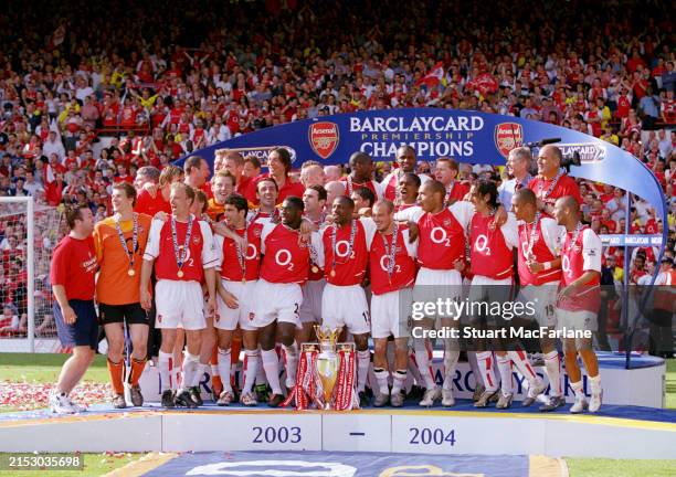 The Arsenal team with the Premier League Trophy after the match between Arsenal and Leicester City in the Premier League at Highbury on May 15, 2004...