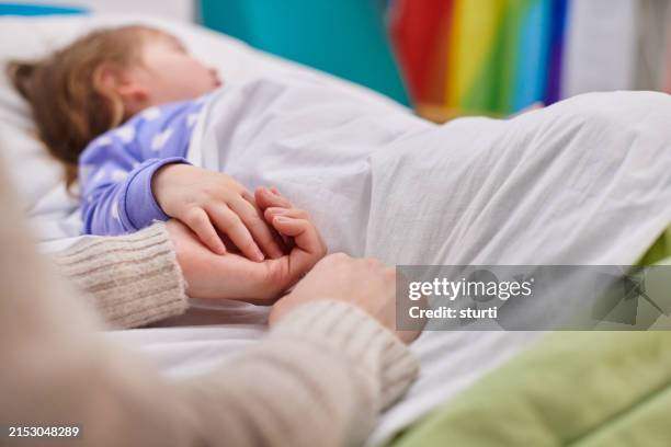 mother and daughter holding hands in hospital - patient stock pictures, royalty-free photos & images