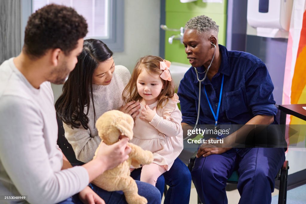 Doctor listening to childs breathing