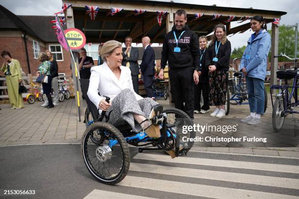 Sophie, Duchess Of Edinburgh, rides an adaptive tricycle during a visit to The Seashell Trust on May 15, 2024 in Cheadle, Greater Manchester....