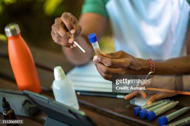 environmental scientists test soil ph with digital analysis - ph test stock pictures, royalty-free photos & images