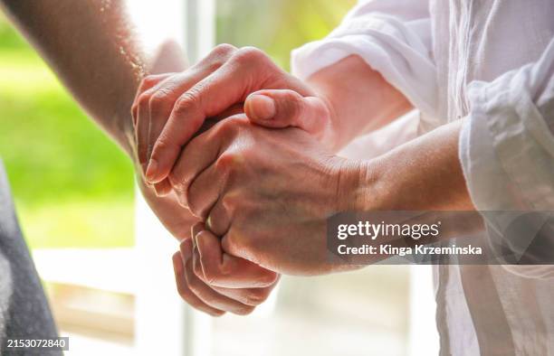holding hands - world mental health day stock pictures, royalty-free photos & images