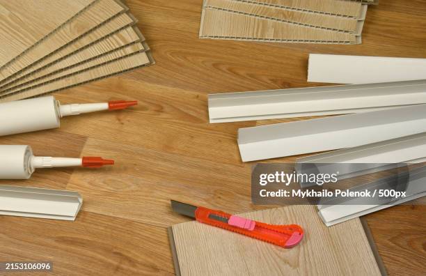 high angle view of work tools on table - linoleum table stock pictures, royalty-free photos & images