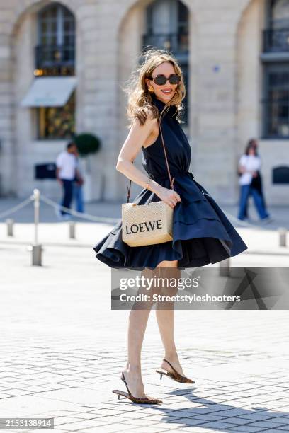 Alexandra Lapp, wearing a Alexandra Lapp x Seidensticker capsule collection with a Taft Light Dress in black, a beige basket bag by Loewe, Escada...