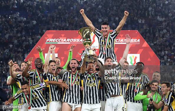 Danilo of Juventus lifts the Coppa Italia trophy after the team's