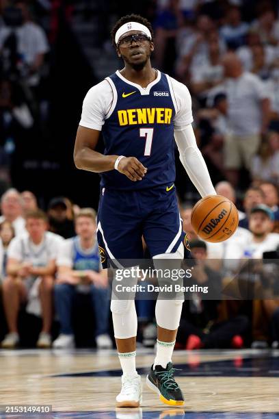 Reggie Jackson of the Denver Nuggets dribbles the ball against the Minnesota Timberwolves in the fourth quarter of Game Four of the Western...