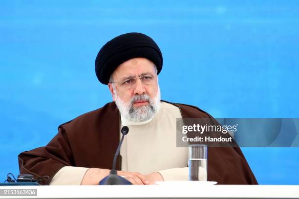 In this handout image supplied by the Office of the President of the Islamic Republic of Iran, Iranian President Ebrahim Raisi Meets with Azerbaijani...