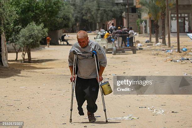 Palestinian amputee makes his way on a street in Rafah, on the southern Gaza Strip, on May 19 amid the ongoing conflict between Israel and the...