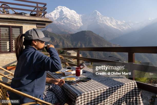 breakfast in ghandruk in nepal - nepal women stock pictures, royalty-free photos & images