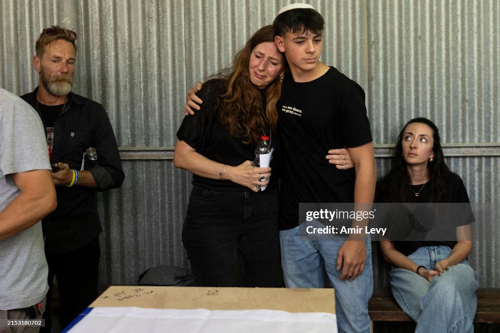 Shani Lock Family members and friends mourn during a funeral service for Shani ...