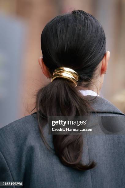 Guest wearing golden hair ring during Australian Fashion Week Presented By Pandora 2024 at Carriageworks on May 16, 2024 in Sydney, Australia.
