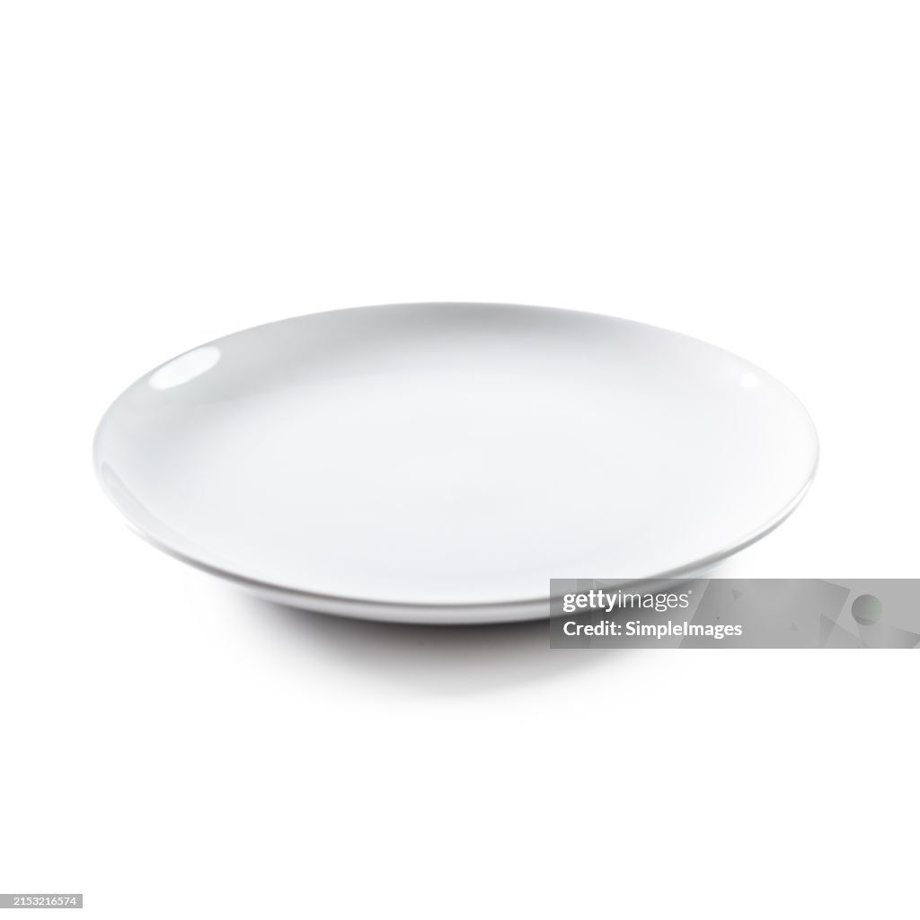 Empty white plate on isolated white background