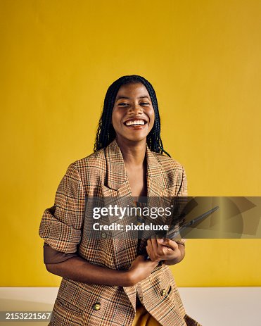 Smiling African American businesswoman in a plaid blazer holding a tablet in a modern office. Empowerment and professional growth in business concept Smiling African American businesswoman in a plaid blazer holding a tablet in a modern office. Empowerment and professional growth in business concept