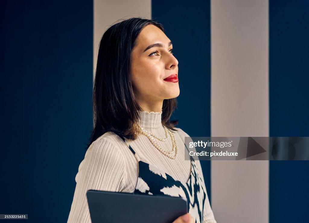 Confident Transgender woman in an office setting, holding a tablet. Empowerment and professional growth in business concept.