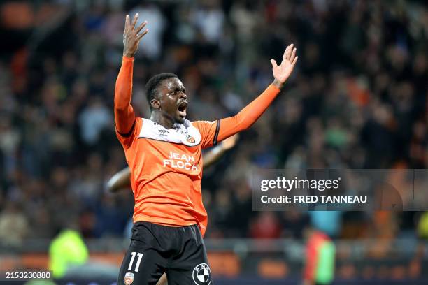 Lorient's Senegalese forward Bamba Dieng celebrates scoring his team's fourth goal during the French L1 football match between FC Lorient and...